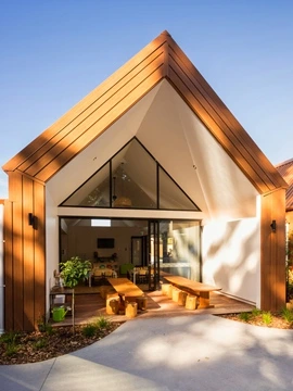 Modern Childcare center featuring architectural steel cladding and roofing with Lux Mimic Wood finish.