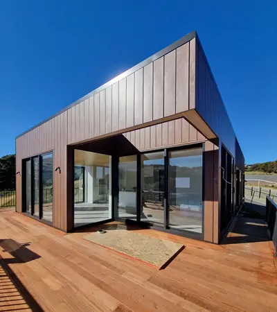 Residential house featuring architectural steel cladding with Interlocking profile in Corten Rust finish.