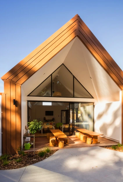 Childcare center featuring Architectural Steel Cladding and Roofing in Lux Maple Wood Finish.