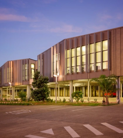 City Impact School featuring Lux – Dark Corten steel roofing and cladding in a variable width Standing Seam profile, installed by Archtech.