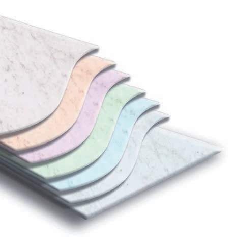 A stack of prepainted steel sheets with a multi-layered protective coating in various soft pastel colors, designed for enhanced durability and aesthetic appeal.