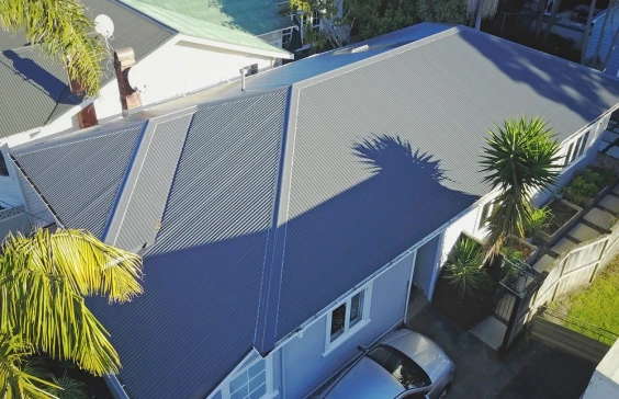 Residential home with Corrugated Roofing, coated in Vitor+ with a Grey Friars color finish.