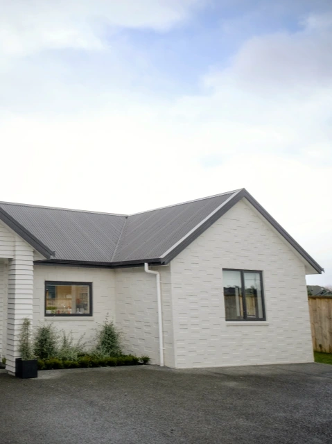 Residential project featuring Corrugate long-run roofing profile in Grey Friars color.