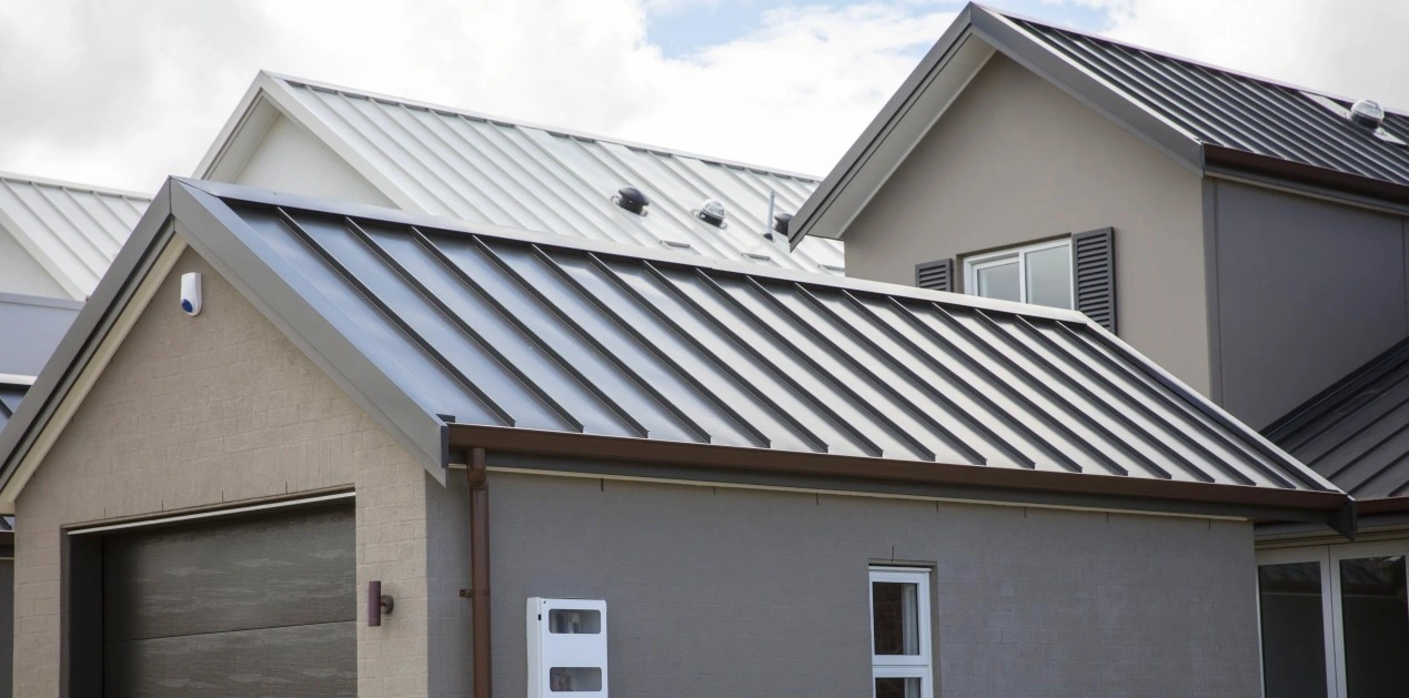 Architectural residential homes with TRS Standing Seam roofing in a modern design.