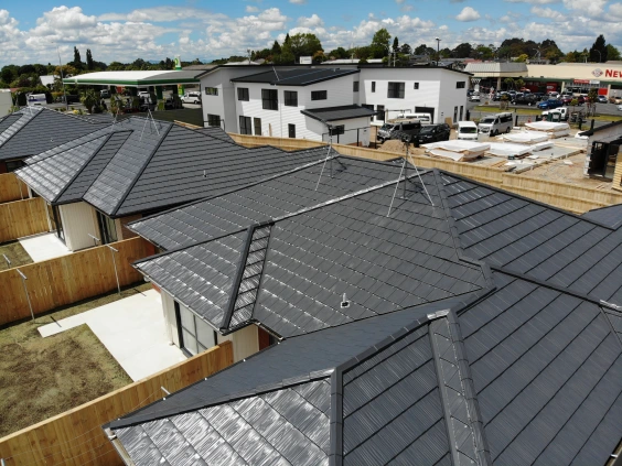 Residential homes featuring TRS Metal Tile roofing, blending durability, sustainability, and modern design.