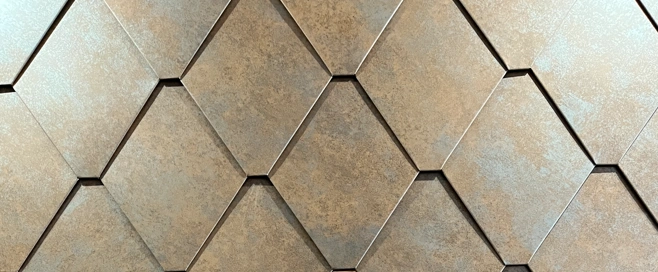 Close-up view of a sample installation using TRS Flat Lock Panels with a metallic textured finish.